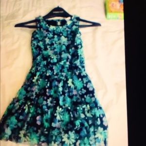 A floral dress with shades of dark blues